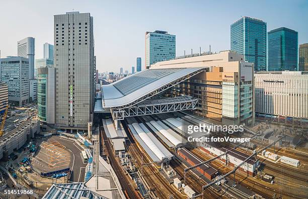 osaka station rail tracks platforms and skyscrapers umeda japan - osaka prefecture stock pictures, royalty-free photos & images