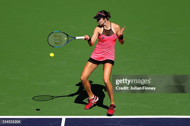 Galina Voskoboeva of Kazakhstan plays a forehand in her match against Heather Watson of Great Britain during day three of the BNP Paribas Open at...