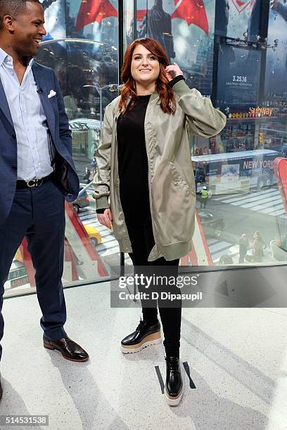 Calloway interviews Meghan Trainor during her visit to "Extra" at their New York studios at H&M in Times Square on March 9, 2016 in New York City.