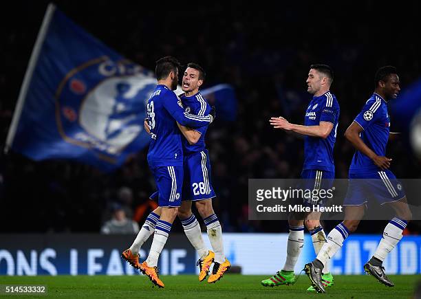 Diego Costa of Chelsea is congratulated by teammates Cesar Azpilicueta and Gary Cahill after scoring a goal to level the scores at 1-1 during the...