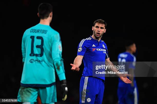 Branislav Ivanovic of Chelsea remonstrates with goalkeeper Thibaut Courtois of Chelsea during the UEFA Champions League round of 16, second leg match...