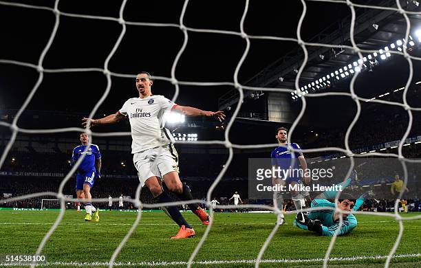Zlatan Ibrahimovic of PSG celebrates after scoring his team's second goal past goalkeeper Thibaut Courtois of Chelsea during the UEFA Champions...