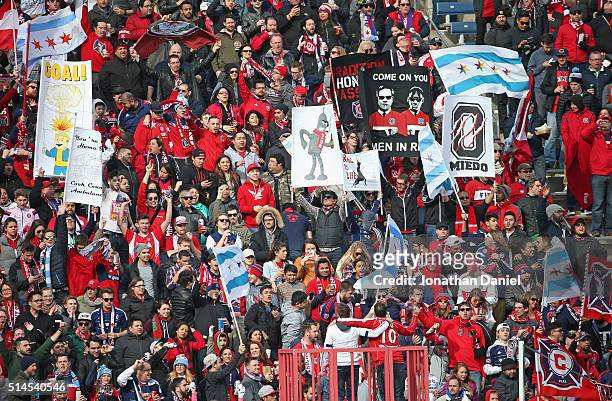 Fans of the Chicago Fire wave flags and banners during a match against the New York City FC at Toyota Park on March 6, 2016 in Bridgeview, Illinois.