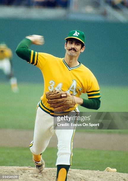 Rollie Fingers of the Oakland Athletics pitches during the World Series against the Cincinnati Reds at Oakland Coliseum on October 1972 in Oakland,...