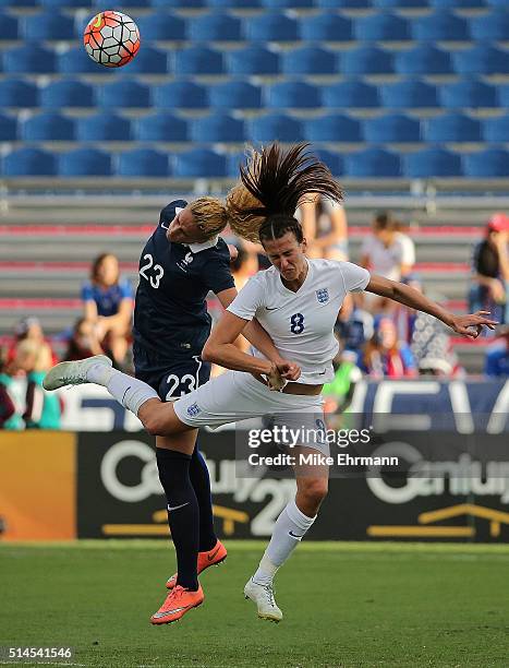 Kheira Hamraoui of France and Jill Scott of England fight for a ball during a match against in the 2016 SheBelieves Cup at FAU Stadium on March 9,...