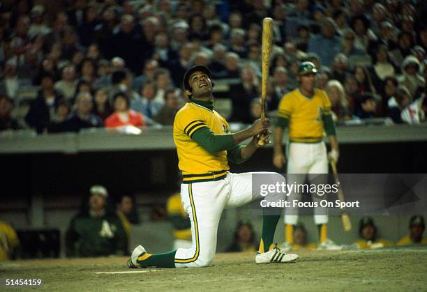 Outfielder Jesus Alou of the Oakland Athletics watches his ball pop up against the New York Mets during the World Series at Shea Stadium on October...