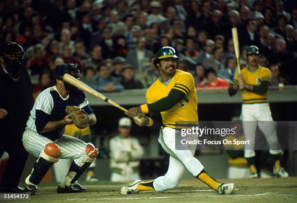 Outfielder Reggie Jackson of the Oakland Athletics swings hard against the New York Mets during the World Series at Shea Stadium on October 1973 in...