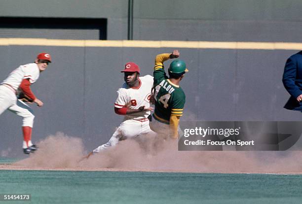 Matty Alou 14 of the Oakland Athletics slides into second base as Cincinnati Reds' Joe Morgan takes the throw during the World series at Riverfront...