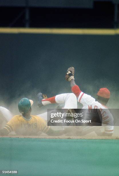 Allan Lewis of the Oakland Athletics slams into Cincinnati Reds' Joe Morgan during the World Series at Riverfront Stadium in Cincinnati, Ohio in...