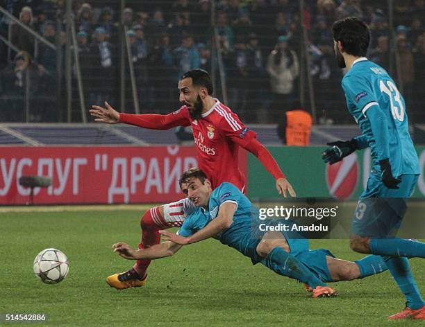 Mauricio of Zenit St.-Petersburg in action against Kostas Mitroglu of SL Benfica during the UEFA Champions League round 16 second-leg football match...