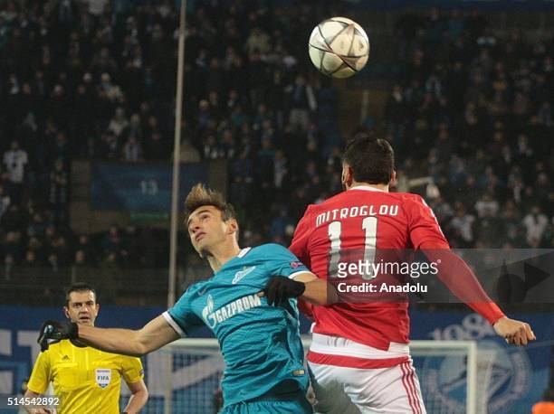 Mauricio of Zenit St.-Petersburg in action against Kostas Mitroglou of SL Benfica during the UEFA Champions League round 16 second-leg football match...