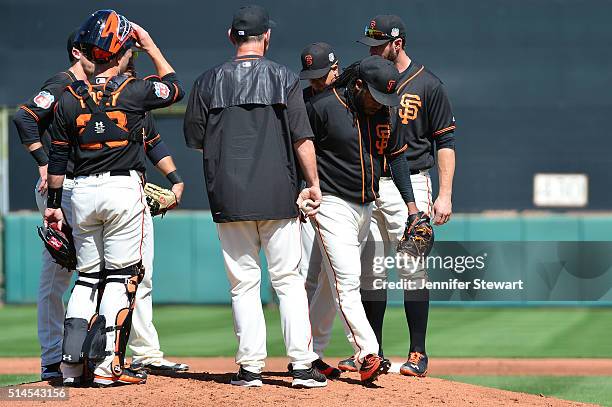 Starting pitcher Johnny Cueto of the San Francisco Giants is removed from the game by manager Bruce Bochy during the second inning of the spring...