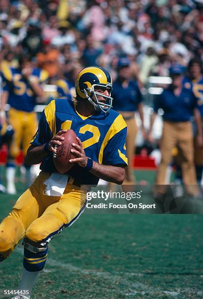 Joe Namath of the Los Angeles Rams readies his pass against the Atlanta Falcons at Atlanta Fulton County Stadium on September 1977 in Atlanta,...