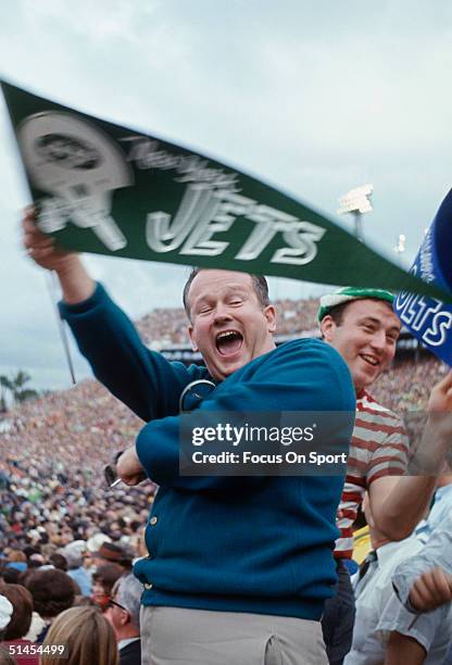 Jets fans wave their hands and a flag during Super Bowl III featuring the Baltimore Colts and the New York Jets at the Orange Bowl on January 12,...