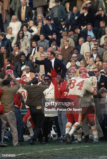 Hank Stram, head coach of the Kansas City Chiefs, is escorted around the field on his team's shoulders during Super Bowl IV against the Minnesota...