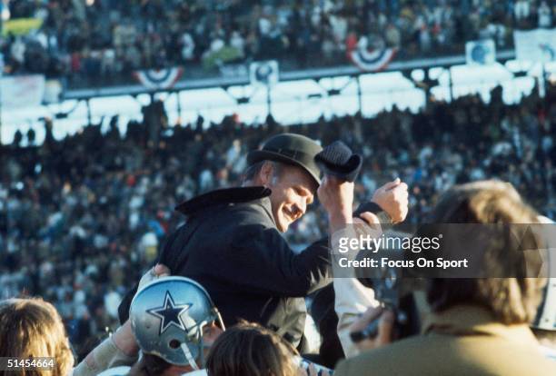 Tom Landry, manager of the Dallas Cowboys is carried off by his team during Super Bowl VI against the Miami Dolphins at Tulane Stadium in New...