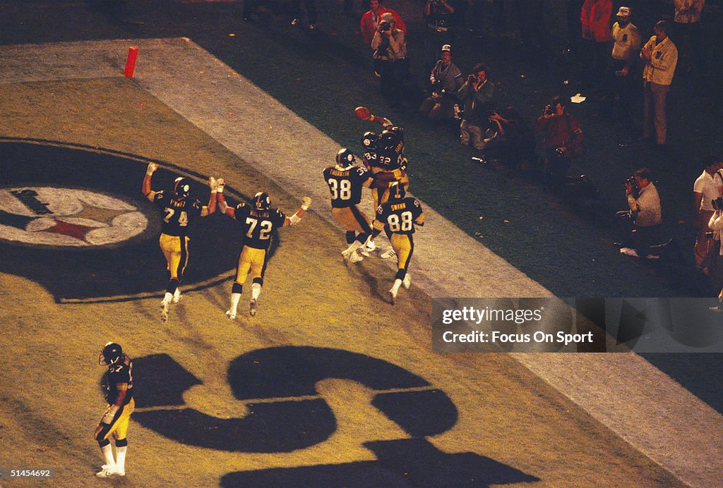 Franco Harris of the Pittsburgh Steelers celebrates a touchdown... News