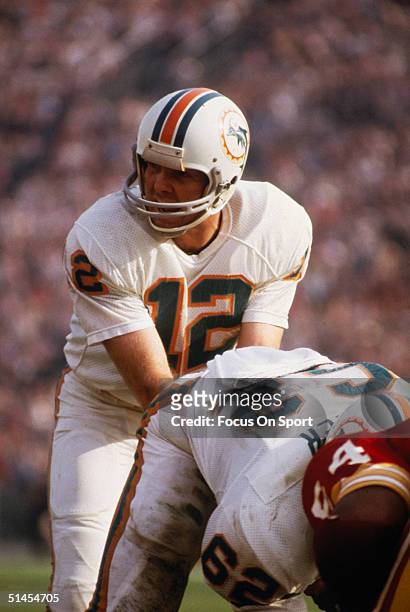 Bob Griese quarterback for the Miami Dolphins waits for the snap during Super Bowl VII against the Washington Redskins at Memorial Coliseum on...