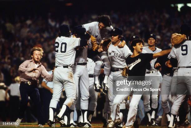 The Yankees meet on the field to celebrate after defeating the Los Angeles Dodgers during the World Series at Dodger Stadium in Los Angeles, October...