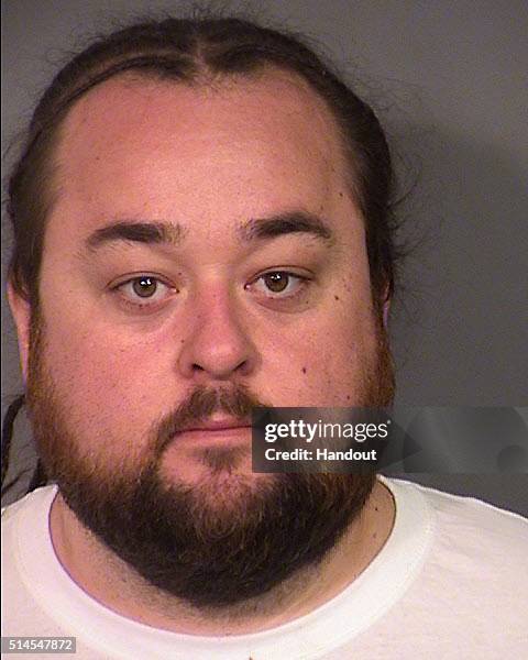 In this handout photo provided by the Las Vegas Metropolitan Police Department, Austin 'Chumlee' Russell is seen in a booking photo after his arrest...