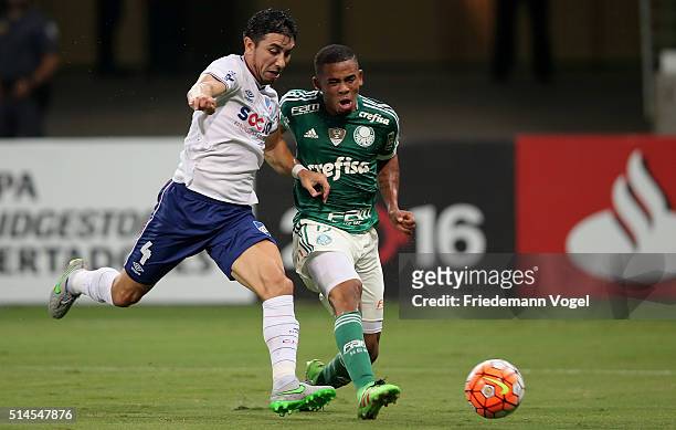 Gabriel Jesus of Palmeiras fights for the ball with Jorge Fucile of Nacional during a match between Palmeiras and Nacional as part of Group 2 of Copa...