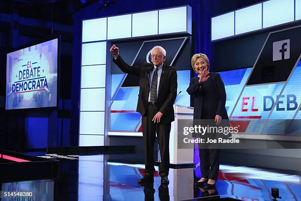 Democratic presidential candidates Senator Bernie Sanders and Democratic presidential candidate Hillary Clinton wave to supporters before the...