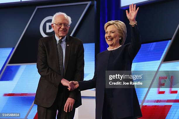 Democratic presidential candidates Senator Bernie Sanders and Democratic presidential candidate Hillary Clinton shake hands before the Univision News...