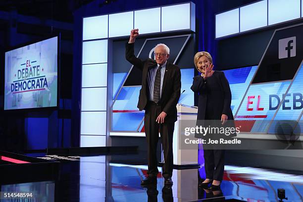 Democratic presidential candidates Senator Bernie Sanders and Democratic presidential candidate Hillary Clinton wave to supporters before the...