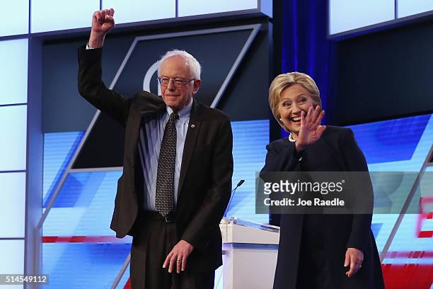 Democratic presidential candidates Senator Bernie Sanders and Democratic presidential candidate Hillary Clinton wave to supporters before the...