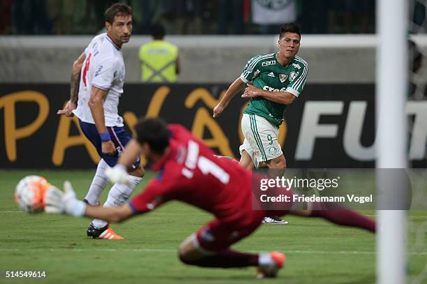 Cristaldo of Palmeiras fights for the ball with Sebastian Eguren and Esteban Conde of Nacional during a match between Palmeiras and Nacional as part...