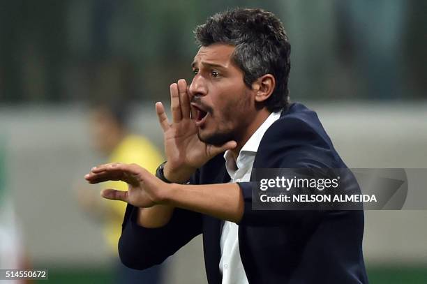 Uruguay's Nacional team coach Gustavo Munua gestures during the 2016 Copa Libertadores football match against Brazil's Palmeiras held at Allianz...