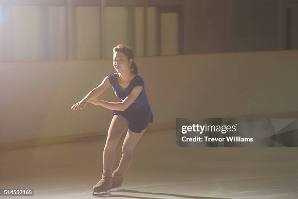 a young woman figure skating - figure skating ストックフォトと画像