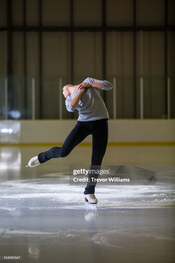 A young woman practicing her figure skating