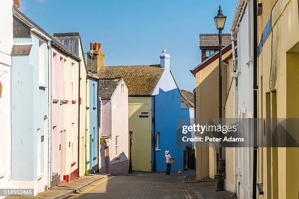 narrow street, tenby - tenby wales stock pictures, royalty-free photos & images