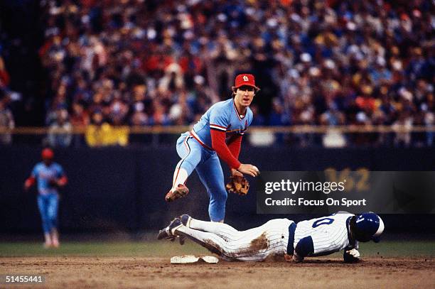 Second baseman Tom Herr of the St. Louis Cardinals tries to avoid Gorman Thomas of the Milwaukee Brewers during a play at second base during the...
