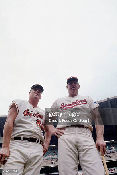 Boog Powell of the Baltimore Orioles and hometown favorite Frank Howard of the Washington Senators pose for the camera before the All-Star Game at...
