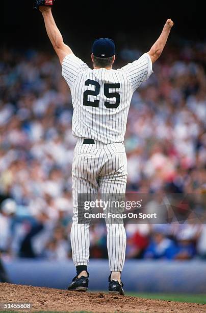 Jim Abbott, pitcher for the New York Yankees, raises his arms in celebration after pitching a no hitter against the Cleveland Indians at Yankee...