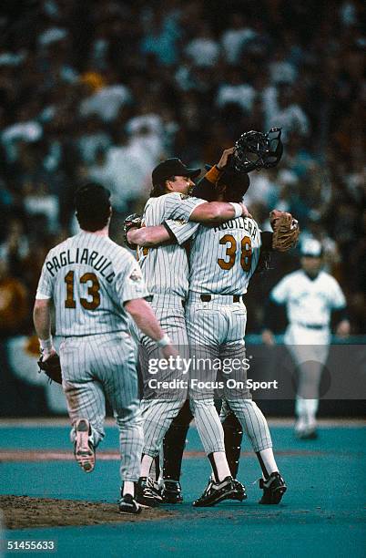 Kent Hrbek, Rick Aguilera and Mike Pagliarulo of the Minnesota Twins celebrate after defeating the Toronto Blue Jays in Game Five of the 1991...