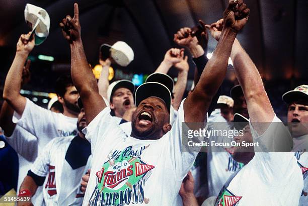 Outfielder Kirby Puckett of the Minnesota Twins leads the cheers during the celebration after winning Game Seven of the World Series against the...