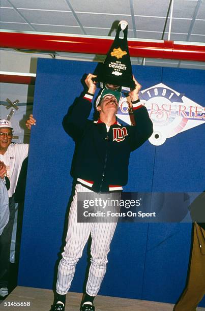 Pitcher Jack Morris of the Minnesota Twins poses with his MVP trophy after winning Game Seven of the World Series against the Atlanta Braves at the...