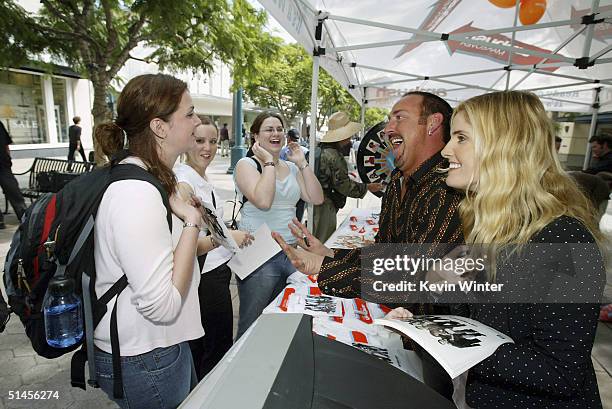 Celebrity stylists William Whatley and Mary Alice Haney sign autographs and give makeover tips at Ambush Makeover's "Its A Whole New Bus Tour" at The...