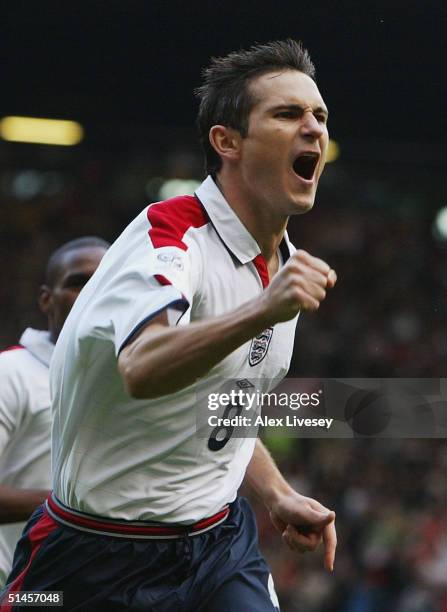 Frank Lampard of England celebrates scoring the first goal during the 2006 World Cup Qualifying match between England and Wales at Old Trafford on...