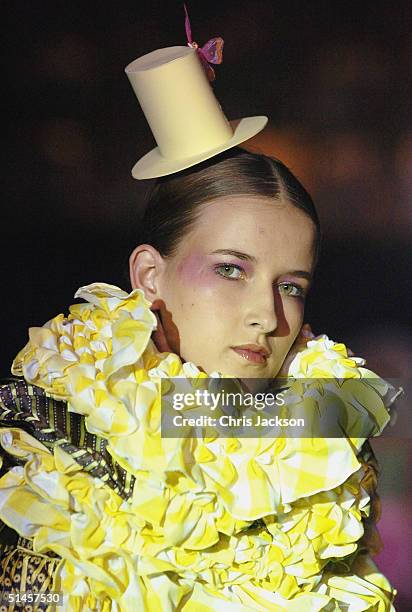 Models walk down the runway at "Fashion In Motion'' previewing the latest work by the Central Saint Martin graduates of 2004, at the Victoria and...