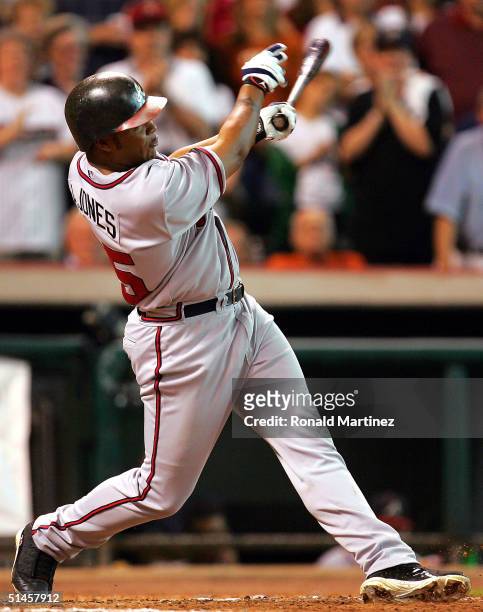 Andruw Jones of the Atlanta Braves hits a three-run home run in the 8th inning against the Houston Astros during game three of the National League...