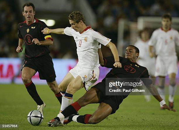 Torres of Spain battles for the ball with Vincent Kompany of Belgium during the group seven 2006 World Cup qualifying match between Spain and Belgium...