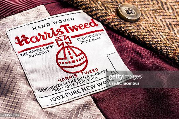 harris tweed label on jacket - tweed fabric stock pictures, royalty-free photos & images