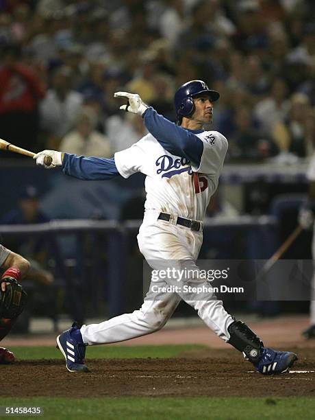 Shawn Green of the Los Angeles Dodgers hits his second home run of the game in the sixth inning against the St. Louis Cardinals during game three of...