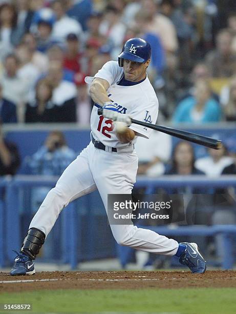 Steve Finley of the Los Angeles Dodgers drives in two runs with a double in the third inning against the St. Louis Cardinals during game three of the...