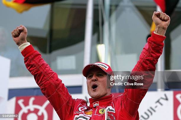 Michael Schumacher of Germany and Ferrari celebrates after winning the Formula One Japanese Grand Prix at Suzuka Circuit on October 10, 2004 in...