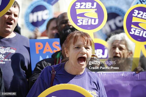 Members of 32 BJ of the Service Employees International Union 1199 chant. NYC mayor Bill de Blasio highlighted a rally on the city hall steps...